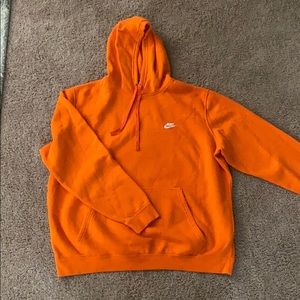 Orange Nike hoodie with white check